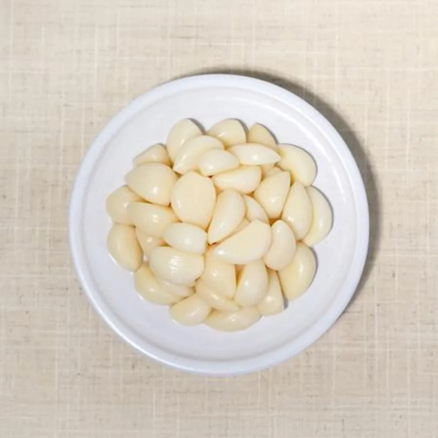 천년의반찬 깐마늘지 1kg 알마늘지 절임 마늘 장아찌 마늘초절임 이미지